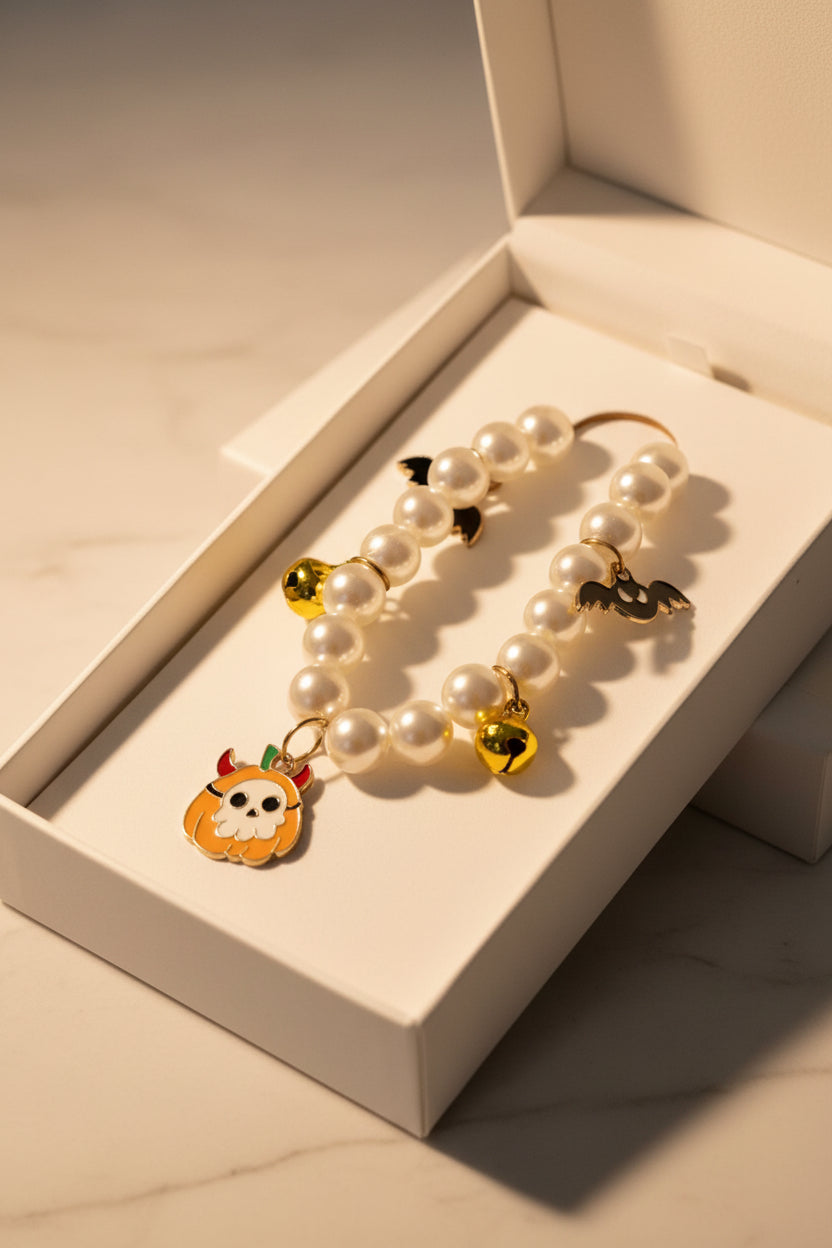 Skull pumpkin and bat pearl necklace with bells small animal